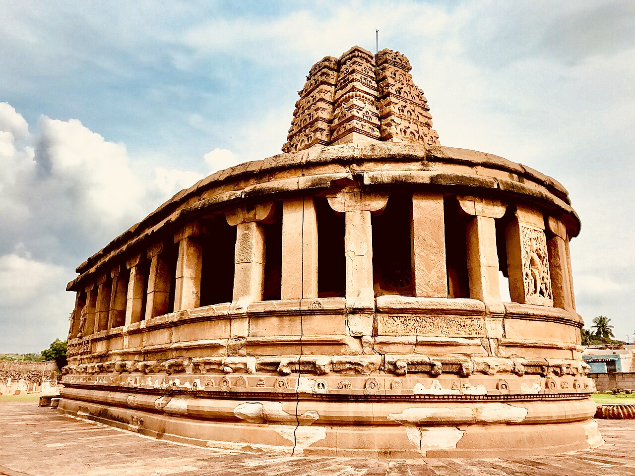 The pillared exterior and curved end of Durga Temple in Aihole